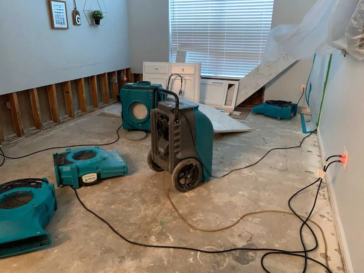 Dehumidifier in flood-cut room for Water Damage Restoration in Salina